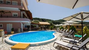 Outdoor pool, pool umbrellas, pool loungers