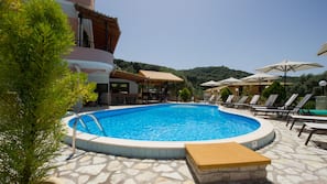 Outdoor pool, pool umbrellas, pool loungers
