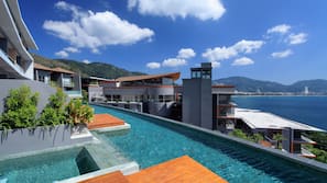 2 outdoor pools, pool umbrellas, pool loungers