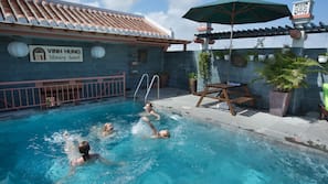 Outdoor pool, pool umbrellas, sun loungers