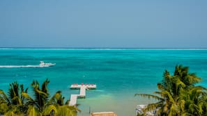 On the beach, white sand, sun loungers, beach towels