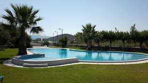 Seasonal outdoor pool, pool umbrellas, sun loungers