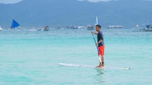 On the beach, white sand, beach shuttle, beach umbrellas