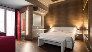 Luxe beddengoed, een minibar, een kluis op de kamer, een bureau