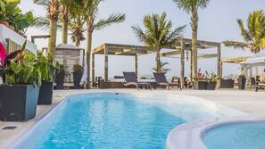 Outdoor pool, pool umbrellas, pool loungers