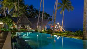 Outdoor pool, free pool cabanas, pool umbrellas