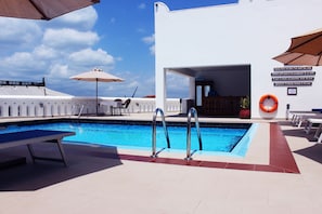 Outdoor pool, pool umbrellas, sun loungers