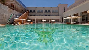 Indoor pool, outdoor pool, open 11 AM to 8 PM, pool loungers