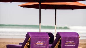 Beach nearby, white sand, beach towels
