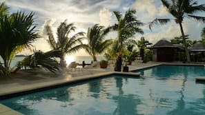 Outdoor pool, open 6:00 AM to 11:00 PM, sun loungers