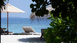 On the beach, white sand, beach towels, rowing