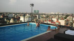 Outdoor pool, pool umbrellas, pool loungers