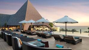 Outdoor pool, open 10:00 AM to 8:00 PM, pool umbrellas