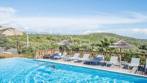 Outdoor pool, pool umbrellas, pool loungers