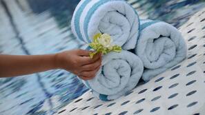Outdoor pool, open 7 AM to 9 PM, pool loungers