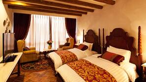Premium bedding, down comforters, minibar, in-room safe