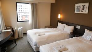 Down comforters, desk, blackout drapes, iron/ironing board