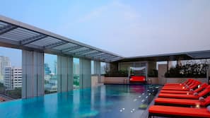 Outdoor pool, open 6:00 AM to 10:00 PM, pool umbrellas, pool loungers