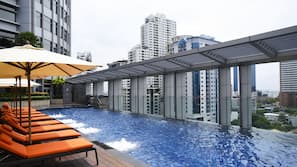 Outdoor pool, open 6:00 AM to 10:00 PM, pool umbrellas, pool loungers