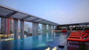 Outdoor pool, open 6:00 AM to 10:00 PM, pool umbrellas, pool loungers