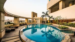 Outdoor pool, open 6 AM to 8 PM, pool umbrellas, pool loungers