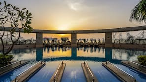 Outdoor pool, open 6 AM to 8 PM, pool umbrellas, pool loungers