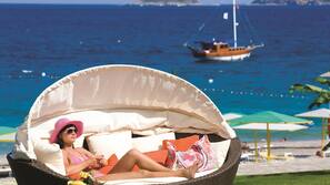 On the beach, beach cabanas, sun loungers, beach umbrellas