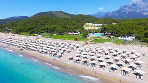 On the beach, beach cabanas, sun loungers, beach umbrellas
