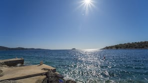 On the beach, sun-loungers, beach towels