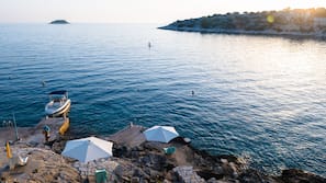 On the beach, sun-loungers, beach towels