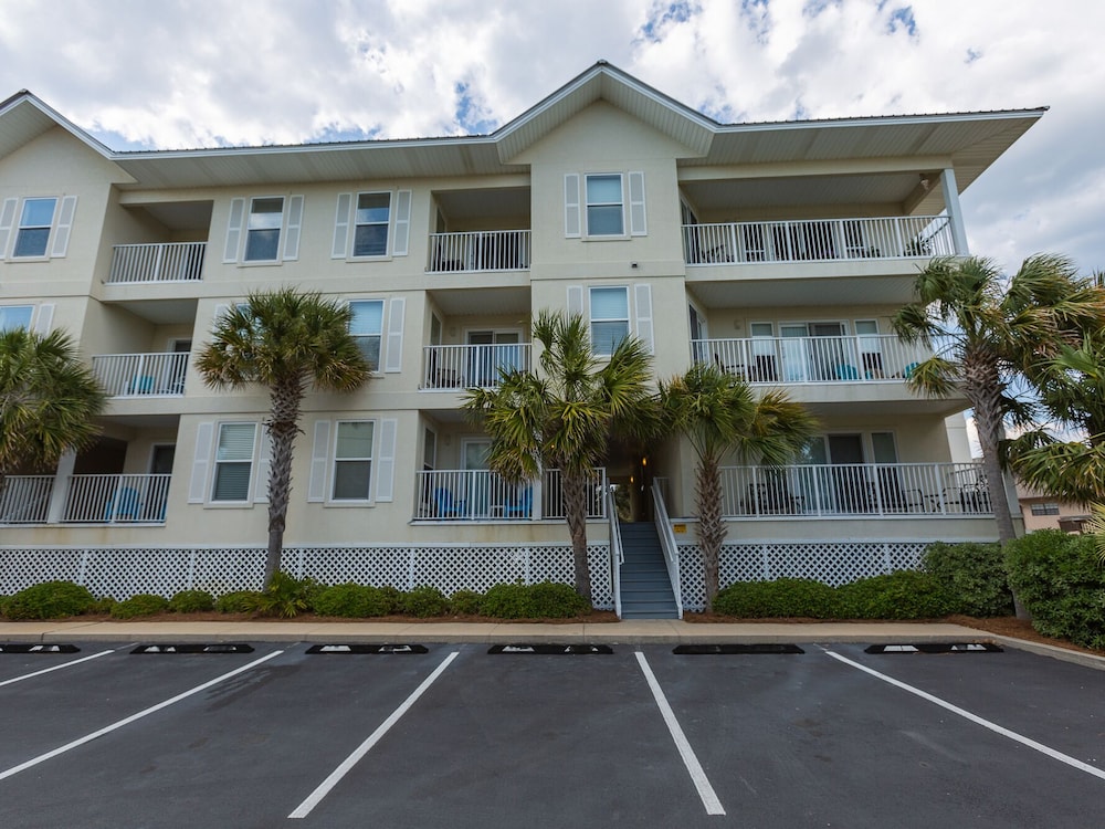 Beach Condo with Private Balcony, Community Pool, & Short Walk to Beach