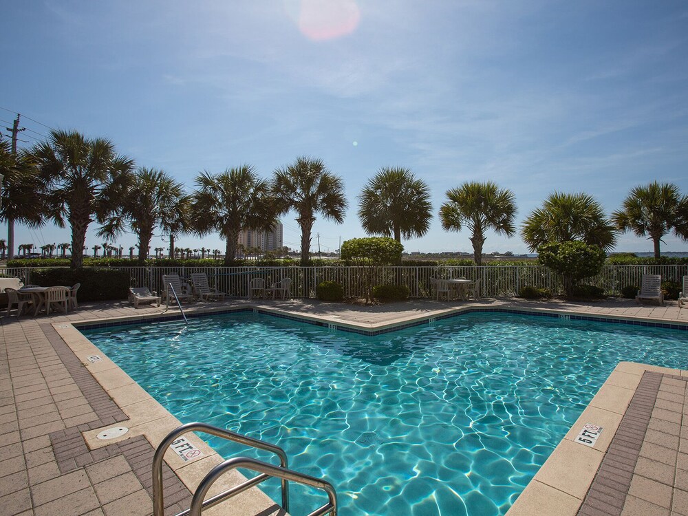 Beach Condo with Private Balcony, Community Pool, & Short Walk to Beach