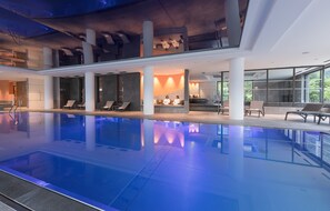 Indoor pool, pool umbrellas, sun loungers