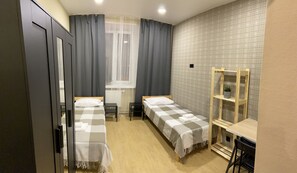 Desk, laptop workspace, free WiFi, bed sheets