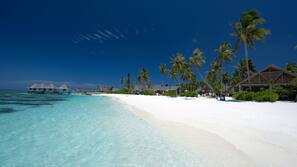 Private beach, white sand, sun-loungers, beach umbrellas