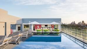 Outdoor pool, open 7:00 AM to 8:00 AM, pool umbrellas