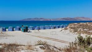 On the beach, sun loungers, beach umbrellas, beach towels