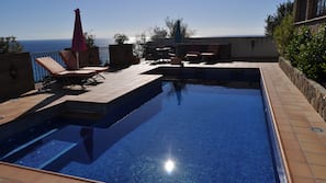 Outdoor pool, pool umbrellas, sun loungers
