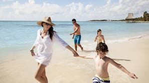 Beach nearby, white sand, sun loungers, beach umbrellas