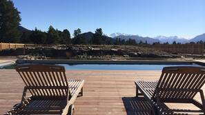 Seasonal outdoor pool, pool umbrellas, pool loungers
