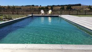 Seasonal outdoor pool, pool umbrellas, pool loungers