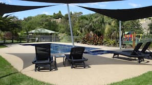Outdoor pool, pool umbrellas, sun loungers