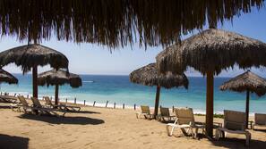 On the beach, sun loungers, beach umbrellas, beach towels