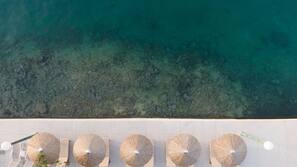 On the beach, sun-loungers, beach umbrellas