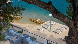 On the beach, sun-loungers, beach umbrellas