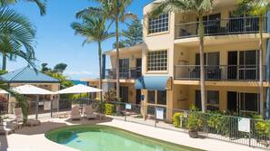 Outdoor pool, open 8:00 AM to 9:00 PM, pool umbrellas, pool loungers