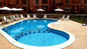 Outdoor pool, pool umbrellas, pool loungers