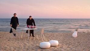 On the beach, sun loungers, beach umbrellas, beach towels