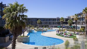 Indoor pool, outdoor pool, pool umbrellas, pool loungers
