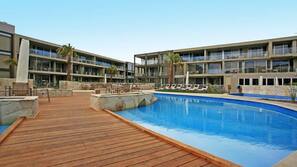 Indoor pool, outdoor pool, pool umbrellas, pool loungers